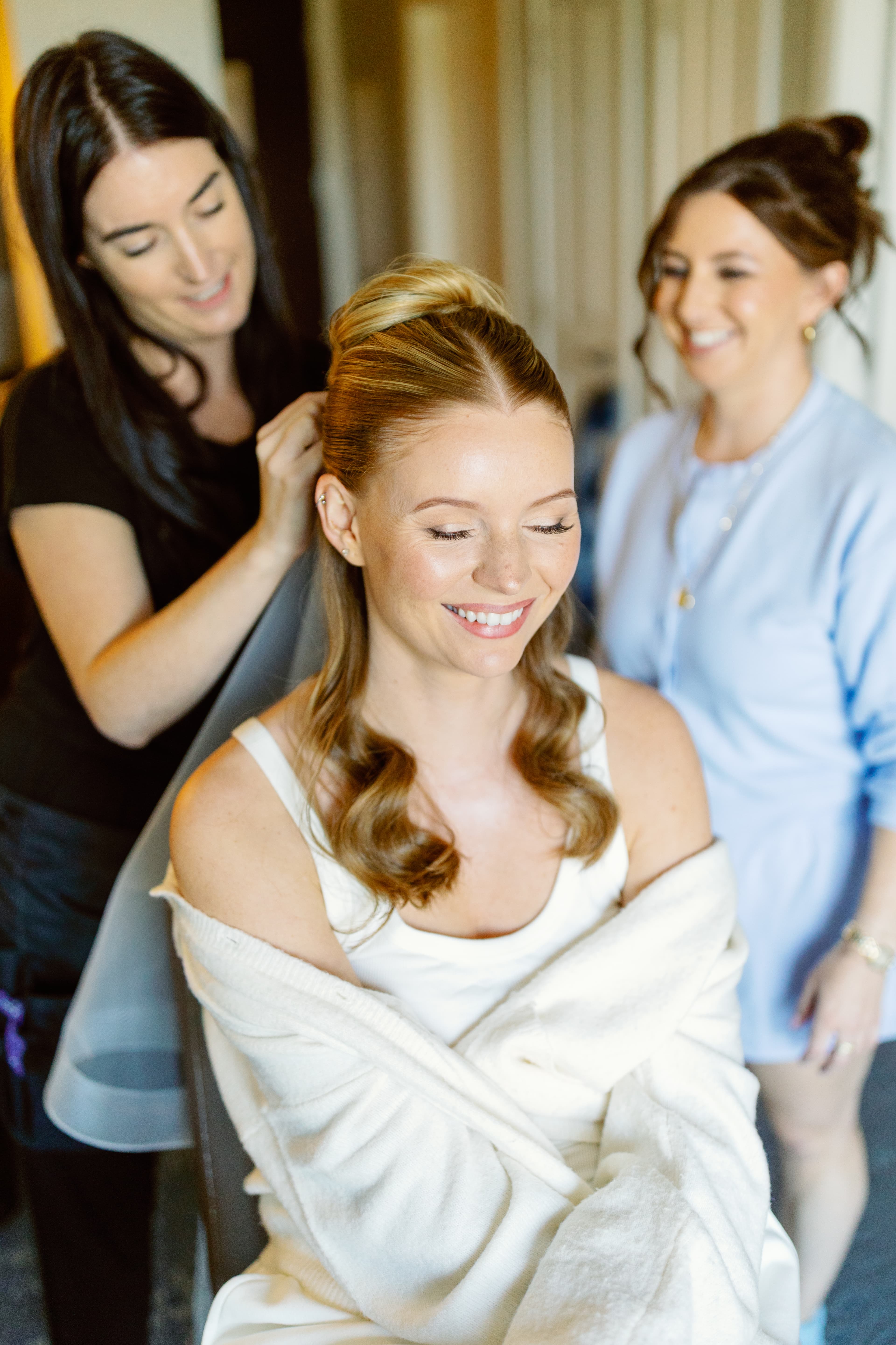 Tisa Wright styling a bride's hair on wedding morning
