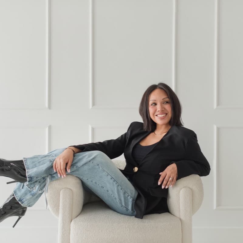 Tisa Wright relaxing in an armchair — TTW Beauty founder